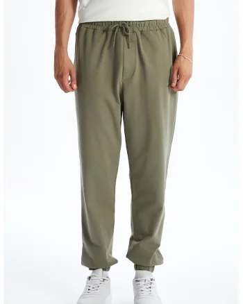 Pantaloni de trening cu croiala conica si snur, Verde feriga